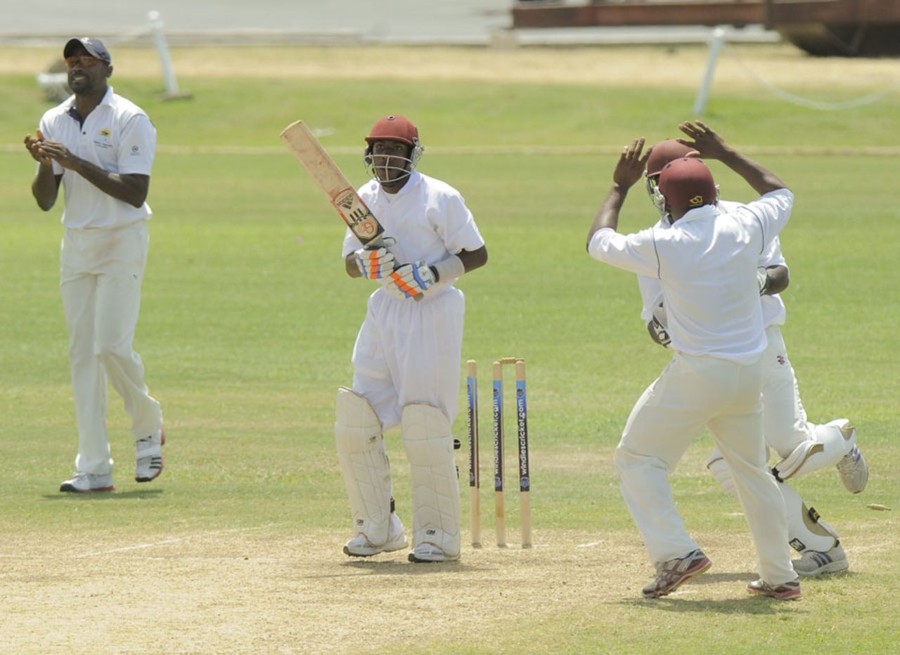 Akeem Saunders is bowled by Derone Davis, Combined Campuses and Colleges v Leeward Islands, Regional Four Day Competition, Day 4, Bridgetown, March 9, 2013