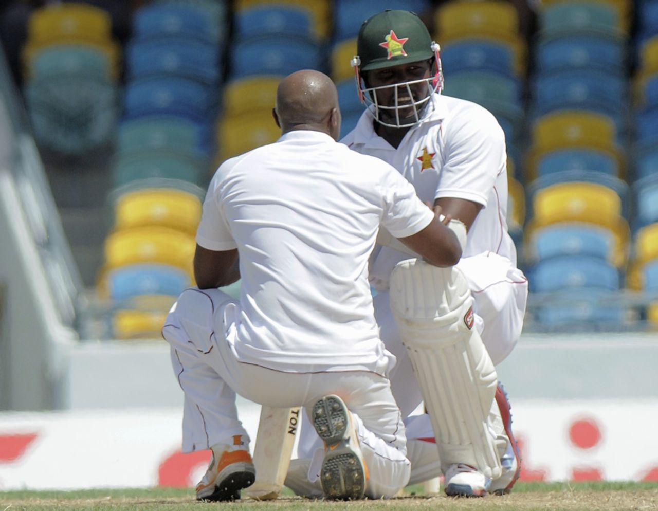 Tino Best checks on Hamilton Masakadza after hitting him with a short ball, West Indies v Zimbabwe, 1st Test, Barbados, 1st day, March 12, 2013