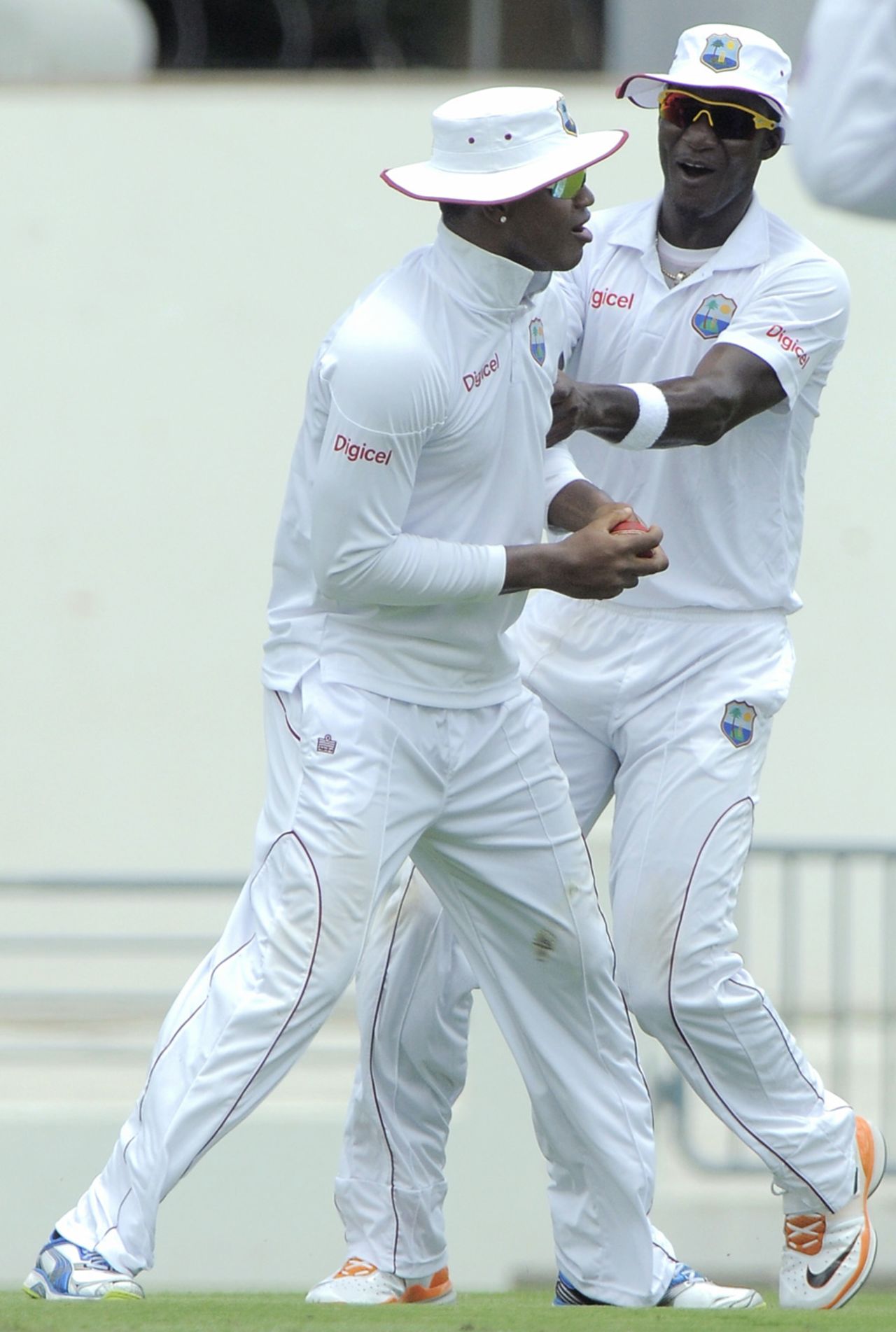 Marlon Samuels is congratulated by Darren Sammy for taking a stunner at gully, West Indies v Zimbabwe, 1st Test, Barbados, 1st day, March 12, 2013