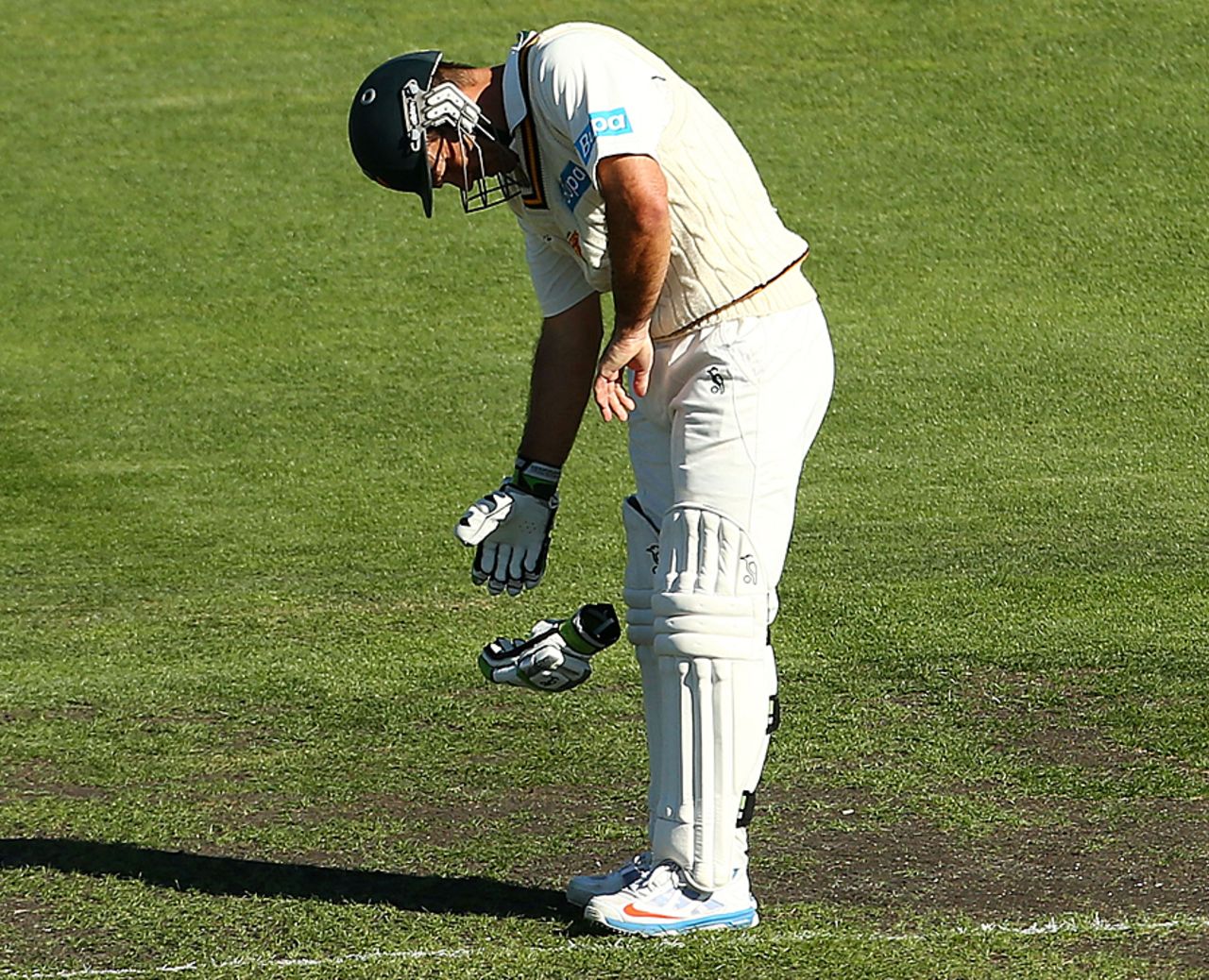 Ricky Ponting looks at his hand after being struck by a delivery, Tasmania v Victoria, Sheffield Shield, Hobart, 1st day, March 14, 2013