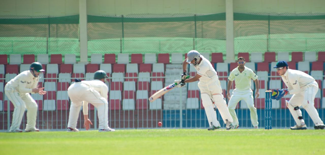 UAE captain Khurram Khan pushes the ball past Ireland's fielders, United Arab Emirates v Ireland, ICC Intercontinental Cup, 3rd day, Sharjah, March 14, 2013