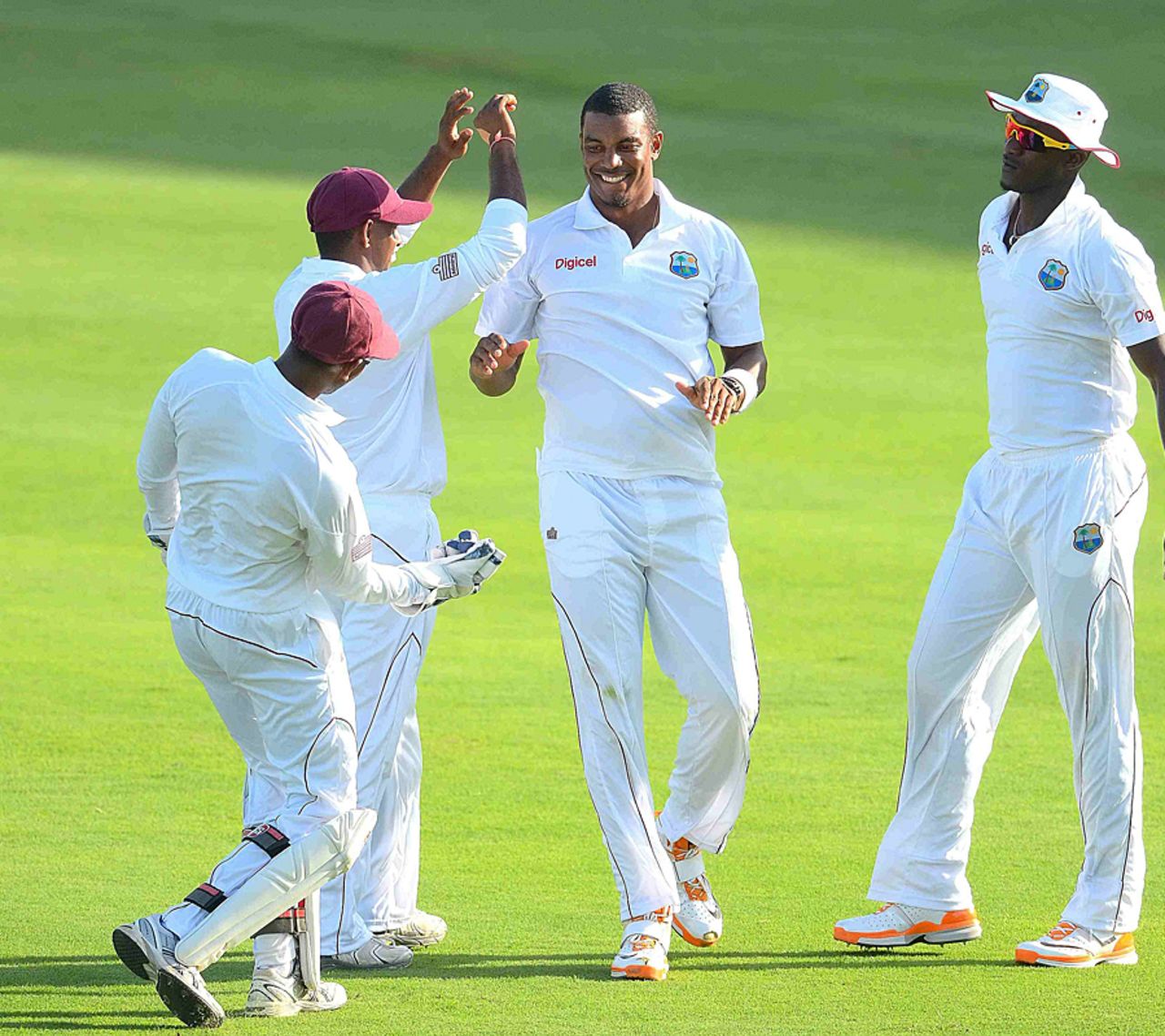 Shannon Gabriel is congratulated by his team-mates after taking a wicket, West Indies v Zimbabwe, 1st Test, Barbados, 2nd day, March 13, 2013