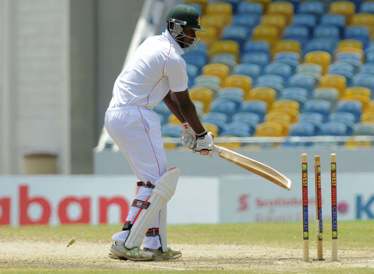 Tendai Chatara looks despondently at his broken stumps, West Indies v Zimbabwe, 1st Test, Barbados, 3rd day, March 14, 2013