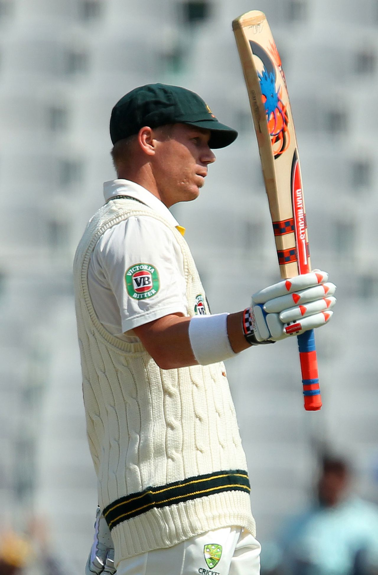 David Warner raises his bat after scoring a half-century, India v Australia, 3rd Test, Mohali, 2nd day, March 15, 2013