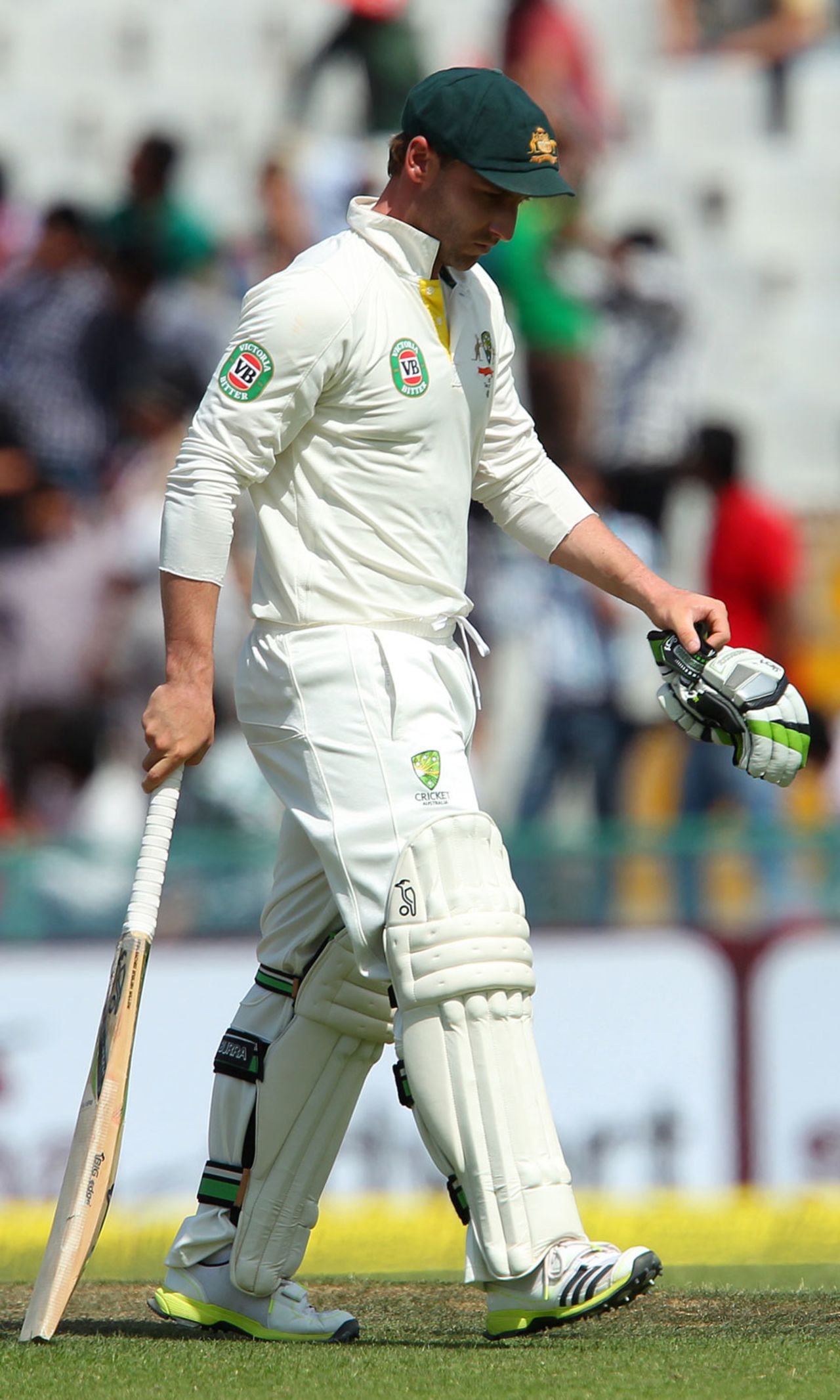 Phillip Hughes walks back after being dismissed, India v Australia, 3rd Test, Mohali, 2nd day, March 15, 2013