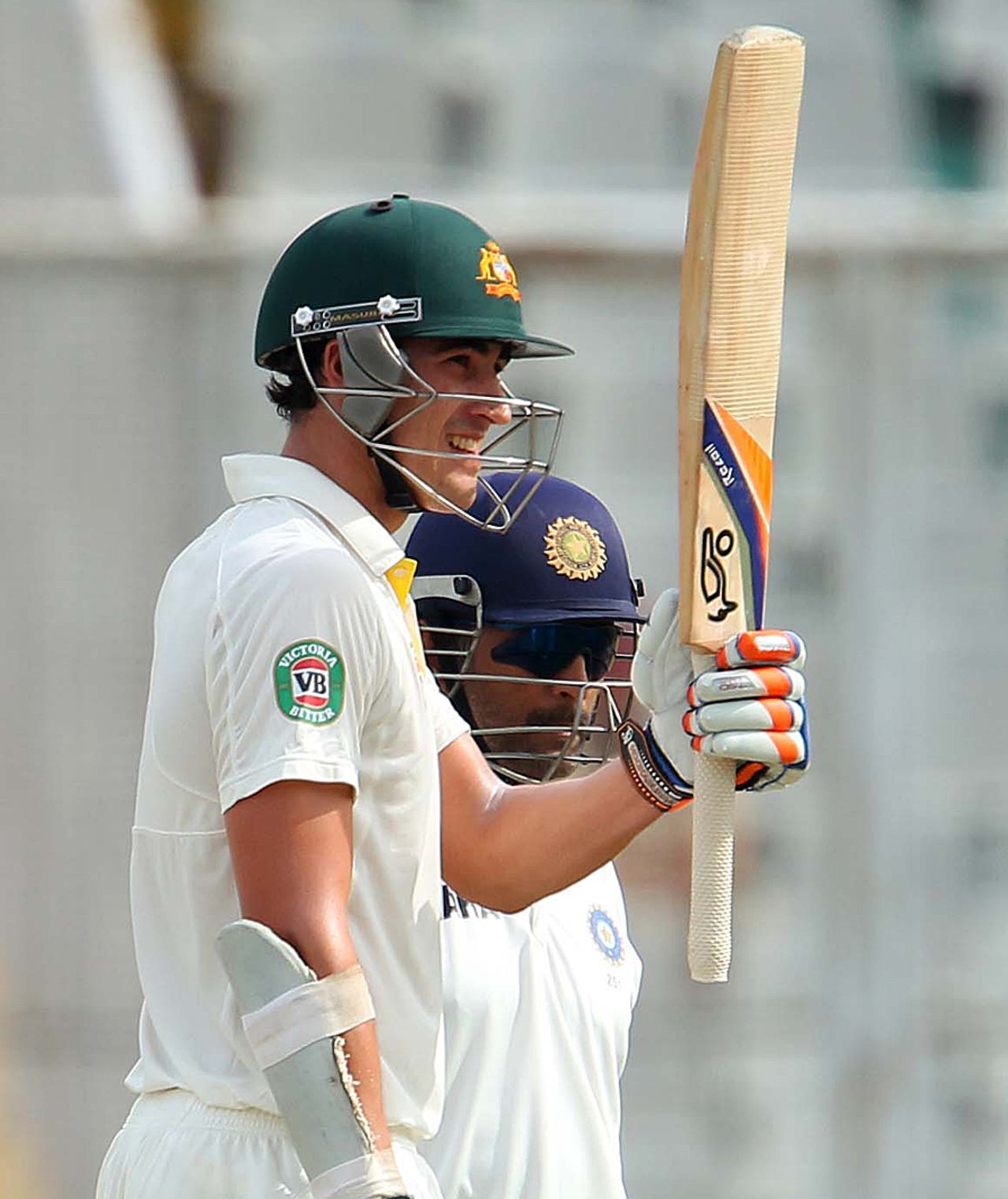 Mitchell Starc raises his bat after reaching fifty, India v Australia, 3rd Test, Mohali, 3rd day, March 16, 2013