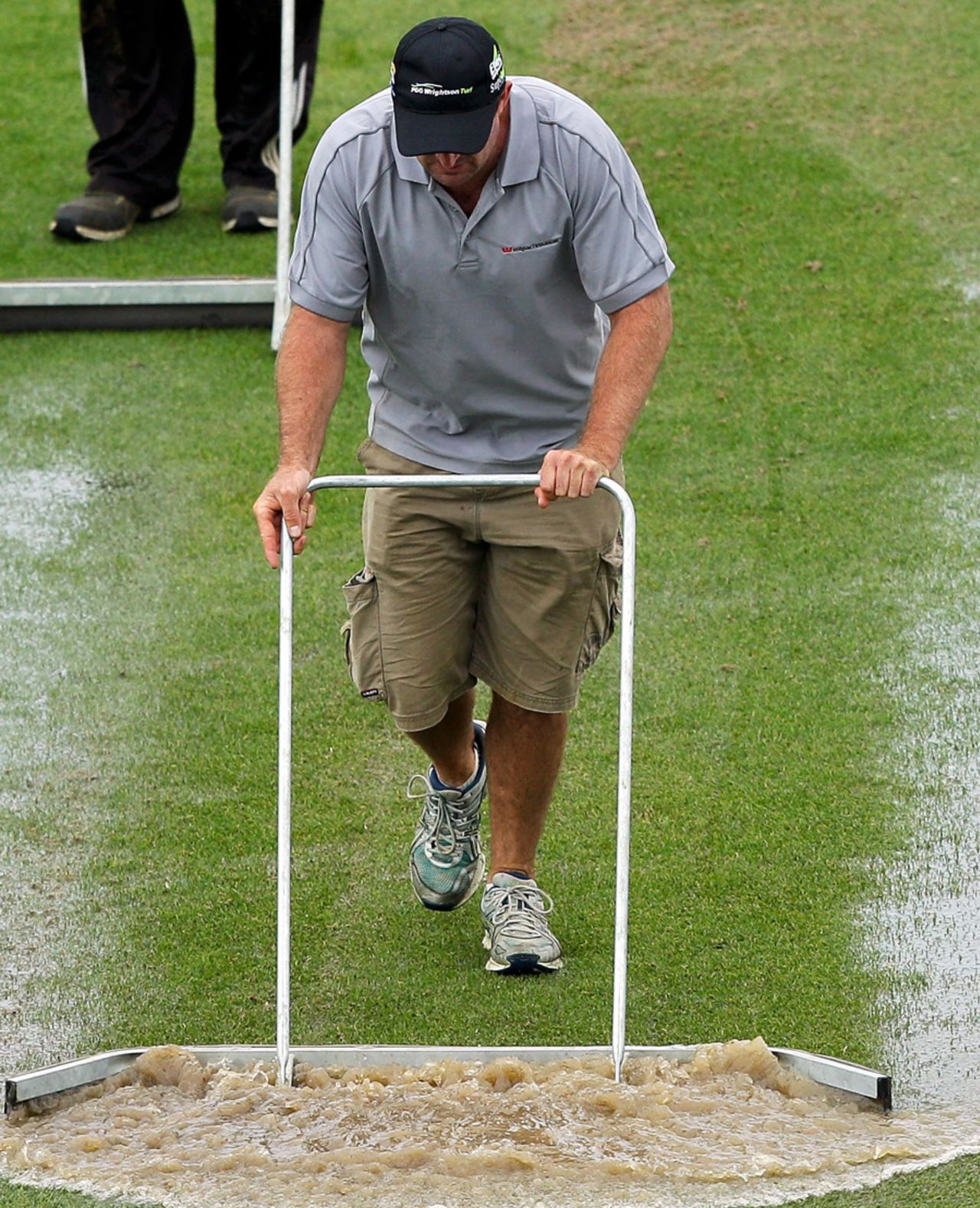 Groundstaff at work to clear water at the Basin Reserve, New Zealand v England, 2nd Test, Wellington, 4th day, March 17, 2013