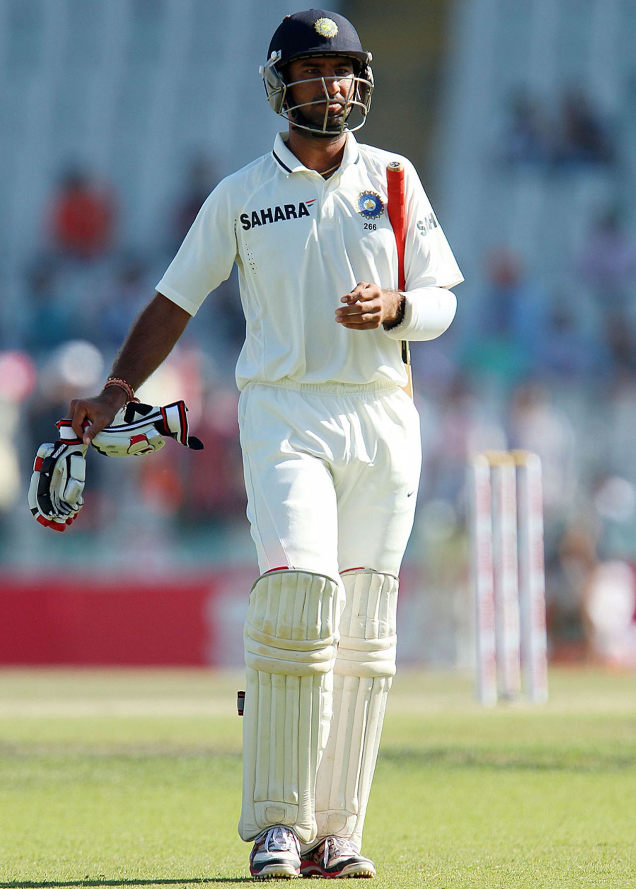 Cheteshwar Pujara walks back after getting a rough decision , India v Australia, 3rd Test, 4th day, Mohali, March 17, 2013