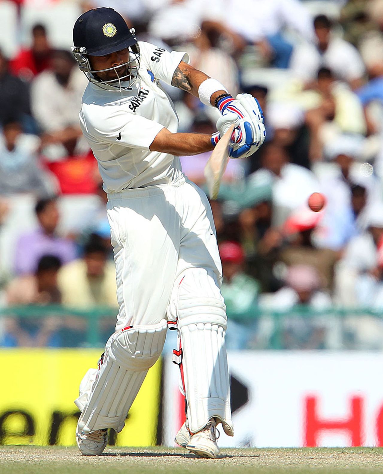 Virat Kohli tries to force it through the on side, India v Australia, 3rd Test, Mohali, 4th day, March 17, 2013