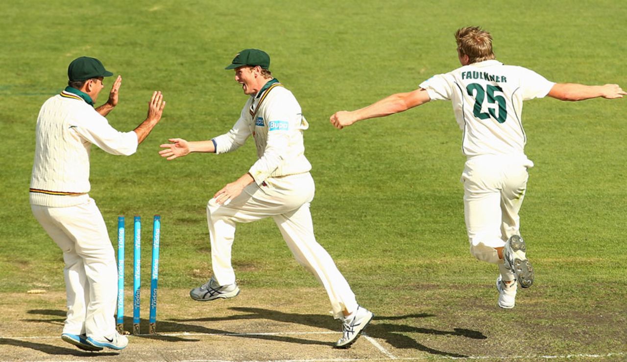 James Faulkner and teammates George Bailey and Ricky Ponting celebrate the fall of a wicket, Tasmania v Victoria, Sheffield Shield, 4th day, Hobart, March 17, 2013