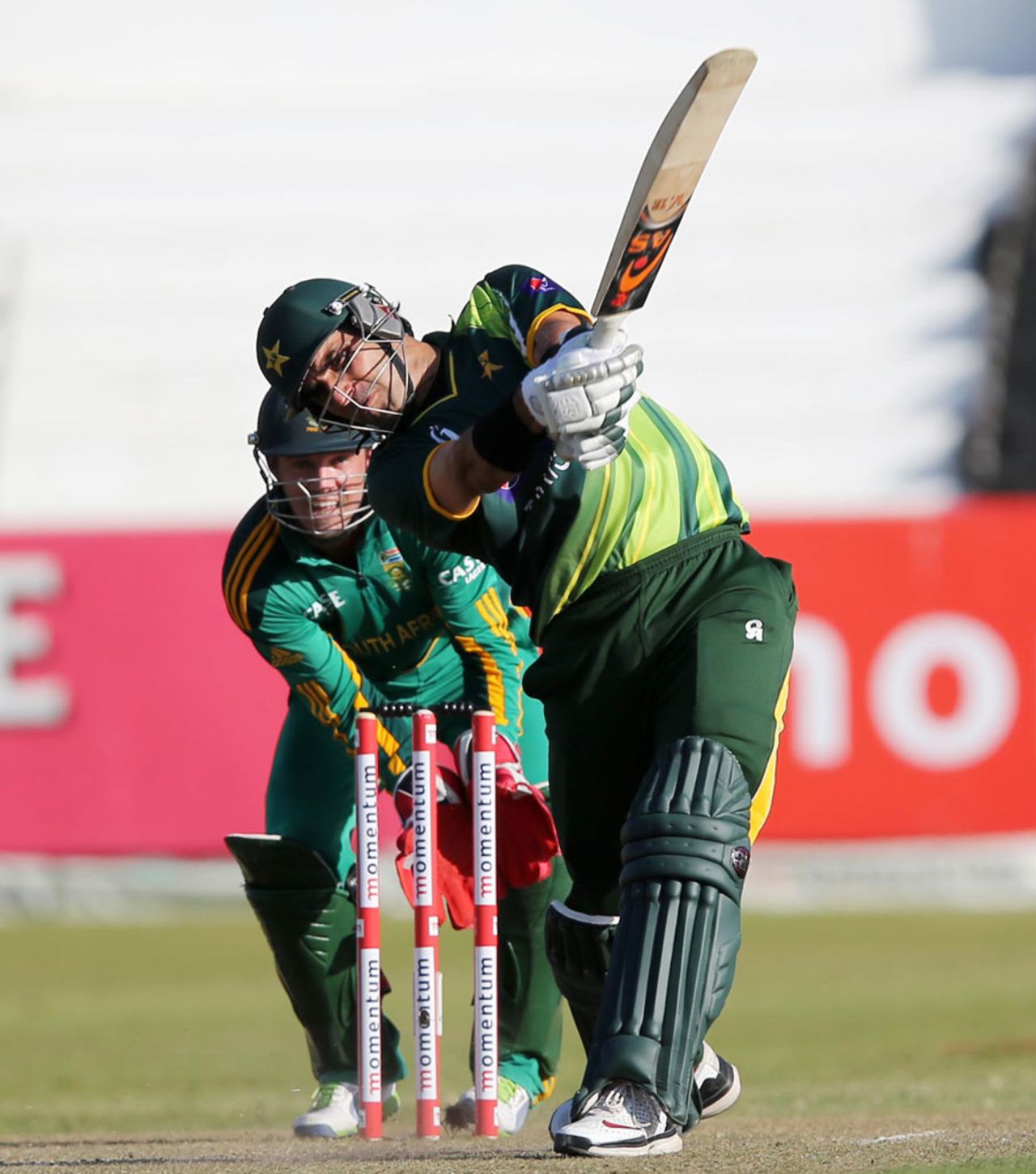 Misbah-ul-Haq launches down the ground, South Africa v Pakistan, 4th ODI, Durban, March 21, 2013