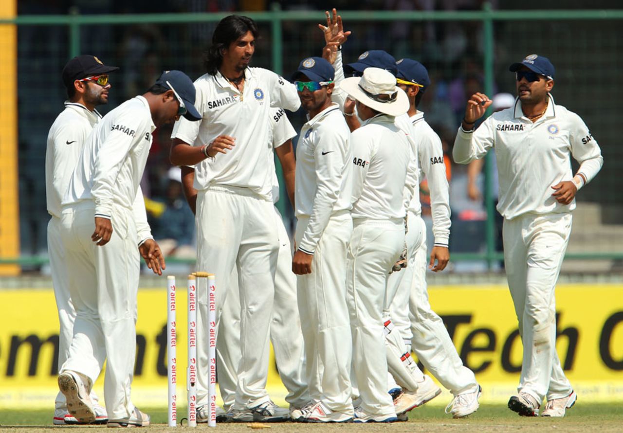 Ishant Sharma and team-mates celebrate Phillip Hughes' wicket, India v Australia, 4th Test, Delhi, 1st day, March 22, 2013