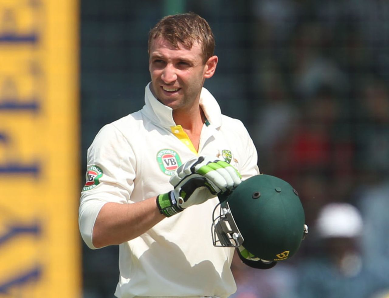 Phillip Hughes checks his helmet after being struck by a bouncer, India v Australia, 4th Test, Delhi, 1st day, March 22, 2013