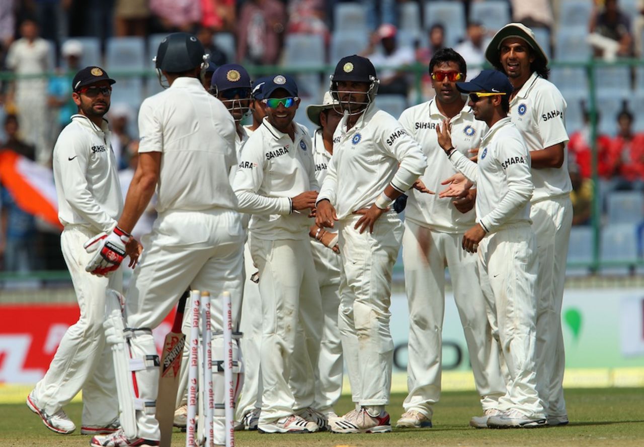 India players wait for Mitchell Johnson to leave after he was bowled, India v Australia, 4th Test, Delhi, 1st day, March 22, 2013