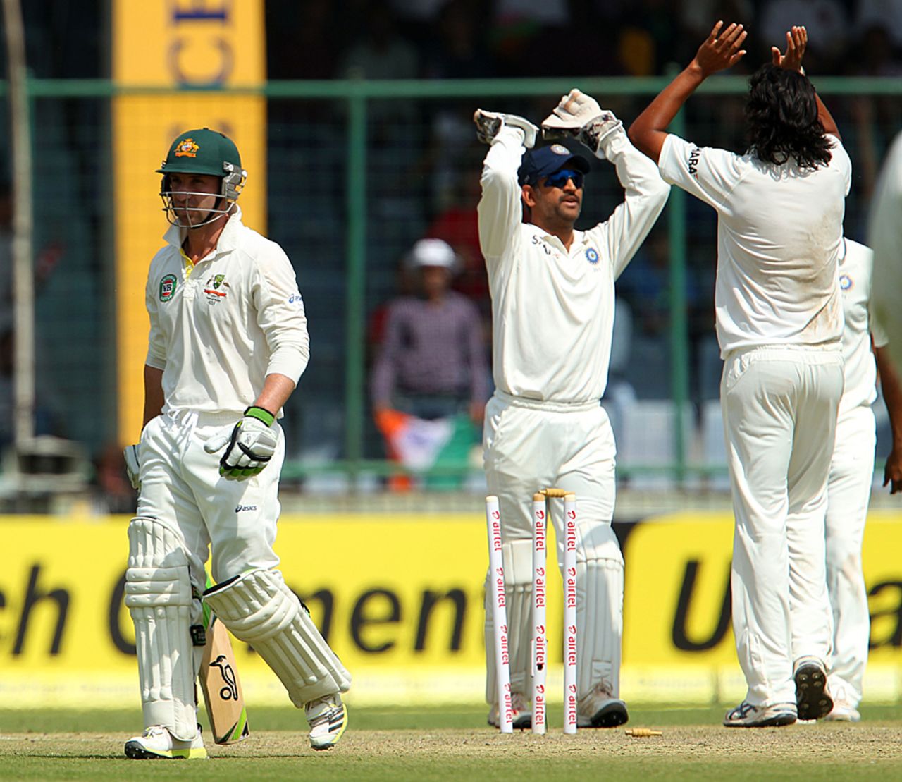 Phillip Hughes walks back after being bowled, India v Australia, 4th Test, Delhi, March 22, 2013