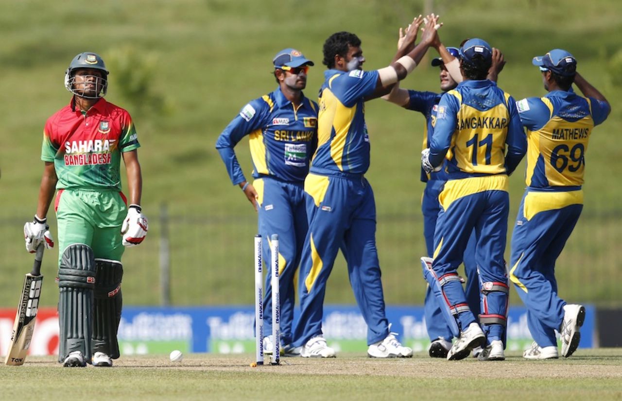 Thisara Perera celebrates the wicket of Anamul Haque with team-mates, Sri Lanka v Bangladesh, 1st ODI, Hambantota, March 23, 2013 
