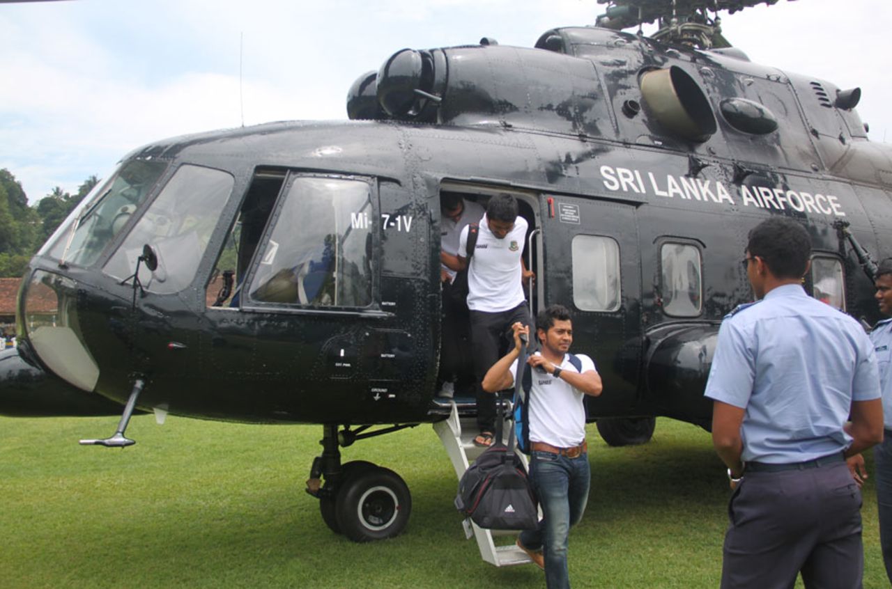 Mushfiqur Rahim and Anamul Haque step off a helicopter, Kandy, March 26, 2013