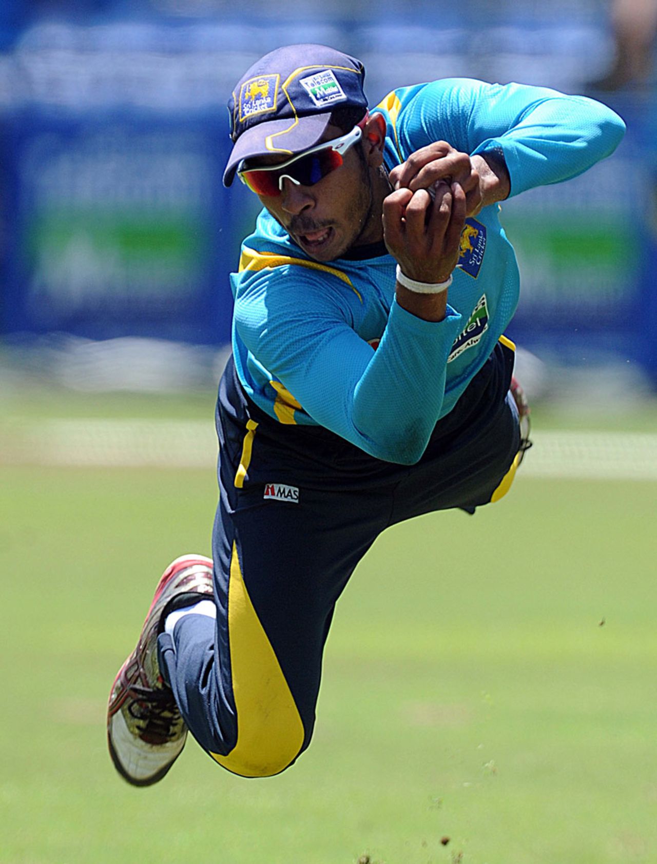 Kithuruwan Vithanage dives to take a catch during a practice session in Pallekele before the T20 match between Sri Lanka and Bangladesh, March 30, 2013