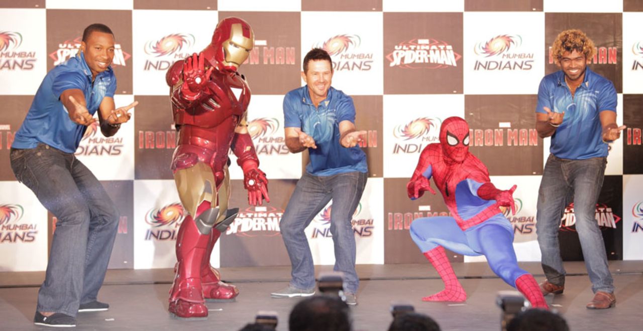 Kieron Pollard, Ricky Ponting and Lasith Malinga pose with superheroes, Mumbai, April 7, 2013