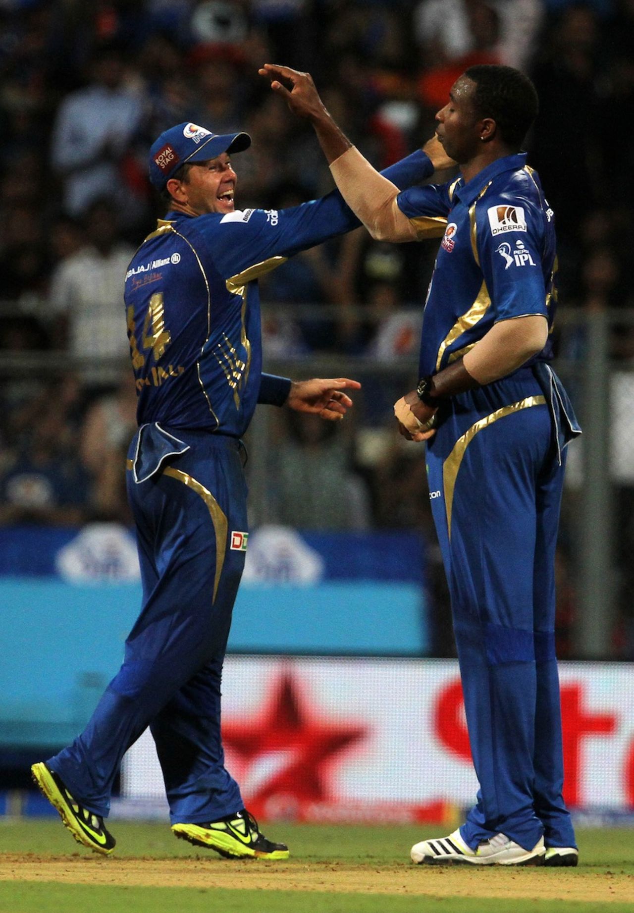 Kieron Pollard and Ricky Ponting celebrate a wicket, Mumbai Indians v Delhi Daredevils, IPL, Mumbai, April 9, 2013