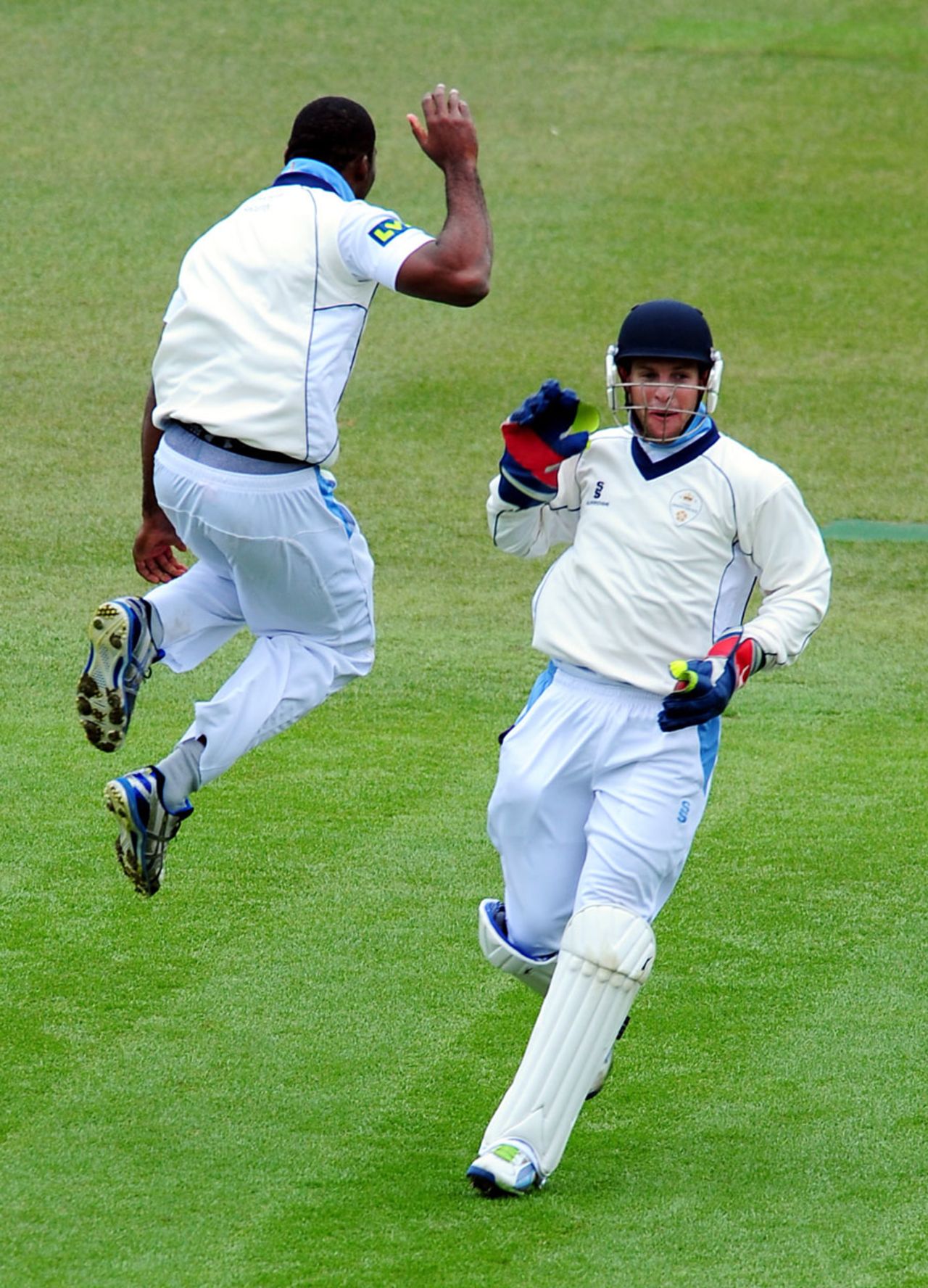Chesney Hughes and Tom Poynton celebrate a wicket, Warwickshire v Derbyshire, County Championship, Division One, Edgbaston, 4th day, April 12, 2013