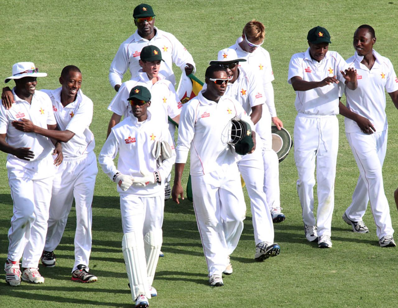 Zimbabwe walk off the pitch after their crushing victory, Zimbabwe v Bangladesh, 1st Test, 4th day, Harare, April 20, 2013