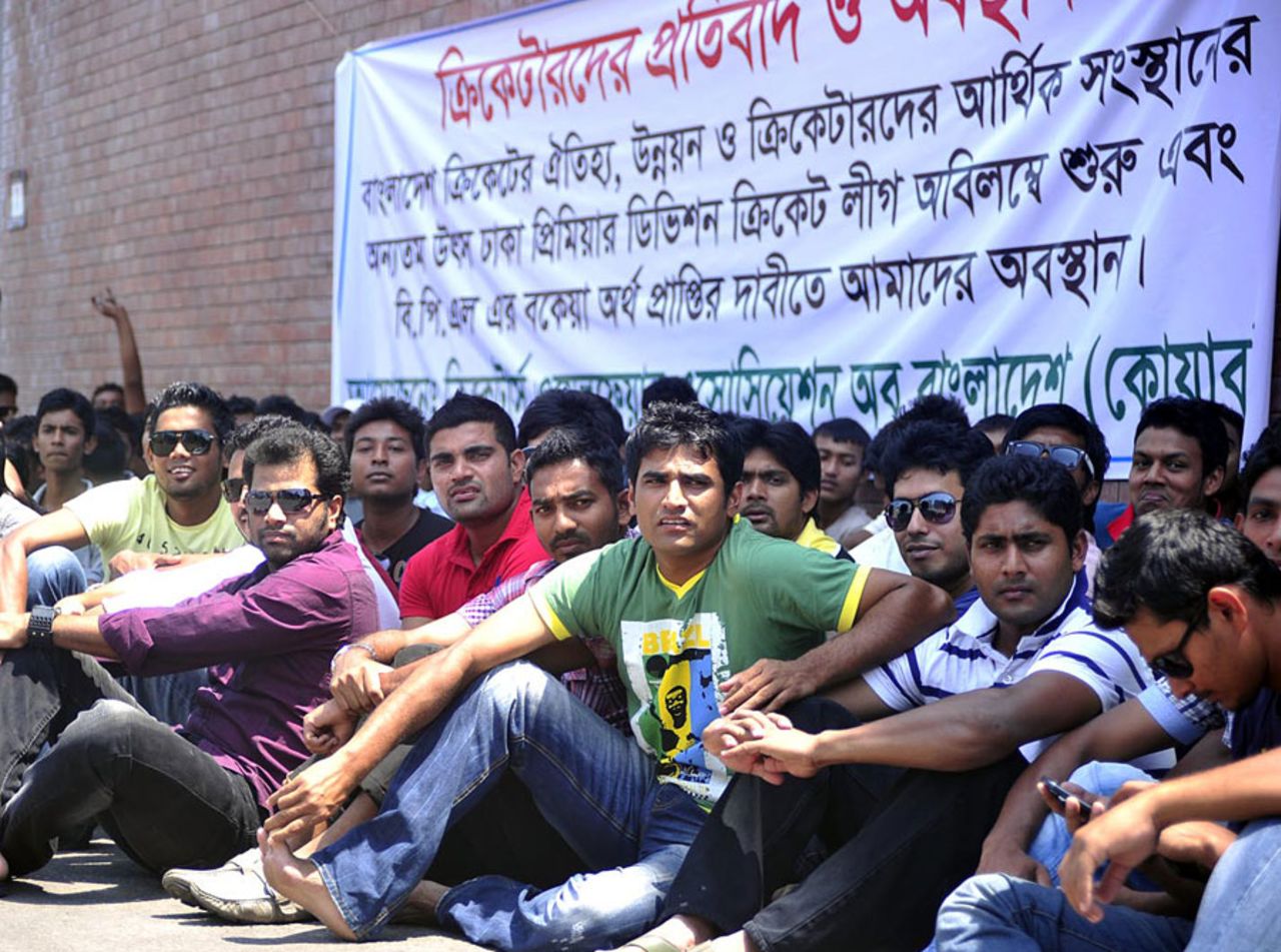 Cricketers sit outside the Shere Bangla National Stadium, protesting the delay in holding the Dhaka Premier League, Mirpur, April 20, 2013