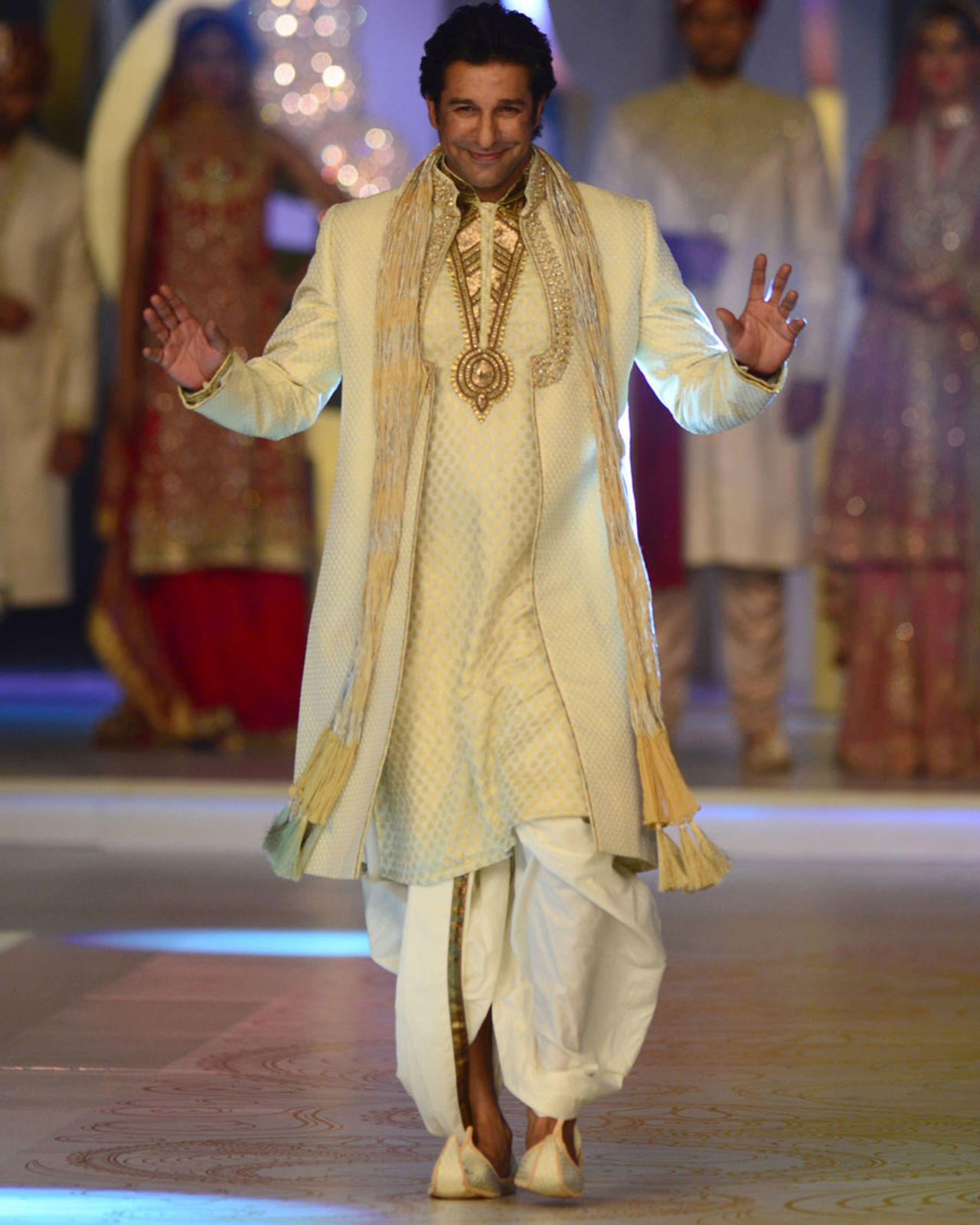 Wasim Akram walks the ramp during the Bridal Couture Week, Karachi, April 21, 2013