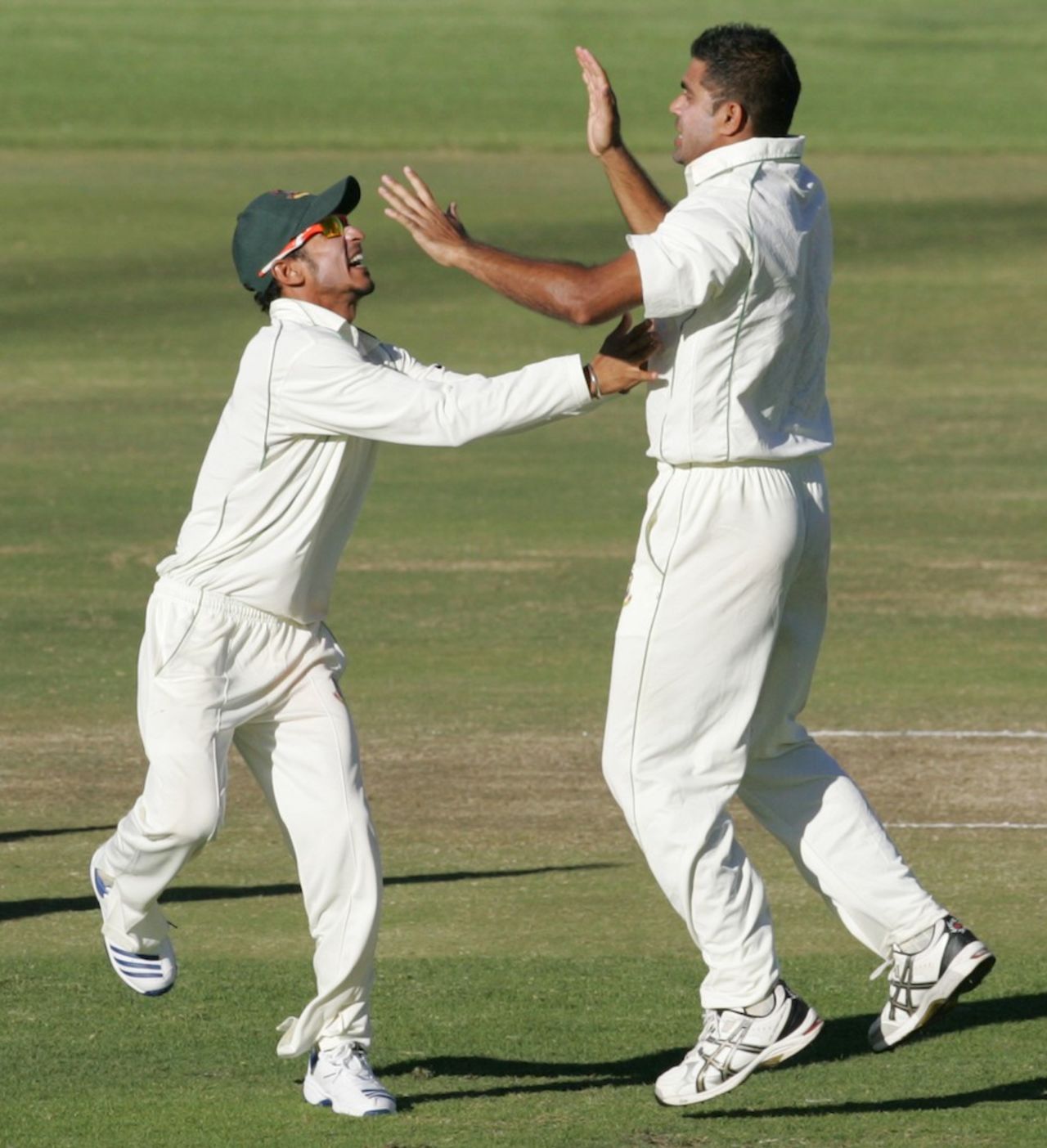 Ziaur Rahman and Nasir Hossain celebrate Brendan Taylor's wicket, Zimbabwe v Bangladesh, 2nd Test, Harare, 4th day, April 28, 2013