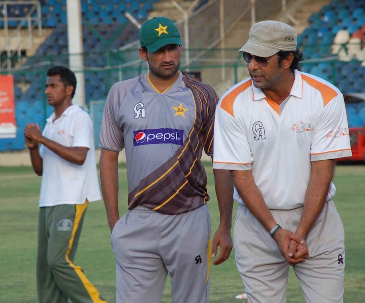 Wasim Akram and Sohail Tanvir at a camp in Karachi, April 28, 2013