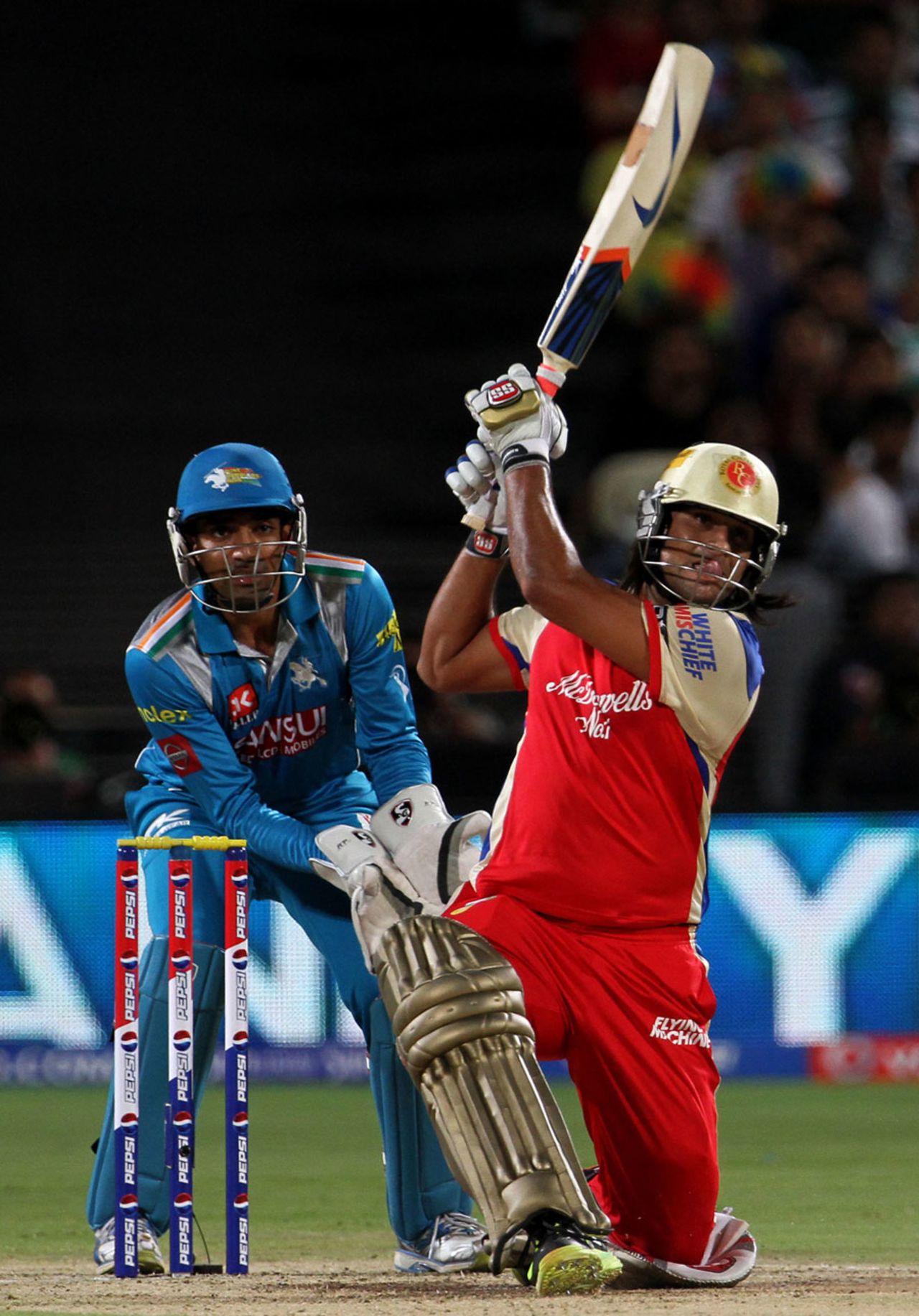 Saurabh Tiwary powers a shot past the bowler, Pune Warriors v Royal Challengers Bangalore, IPL 2013, Pune, May 2, 2013