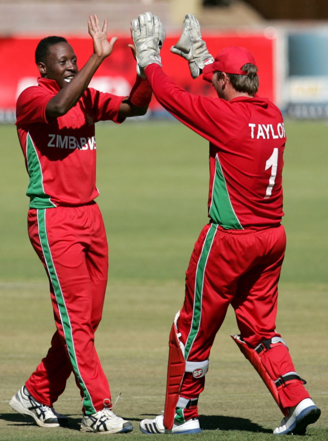 Shingi Masakadza celebrates a wicket with Brendan Taylor, Zimbabwe v Bangladesh, 1st ODI, Bulawayo, May 3, 2013