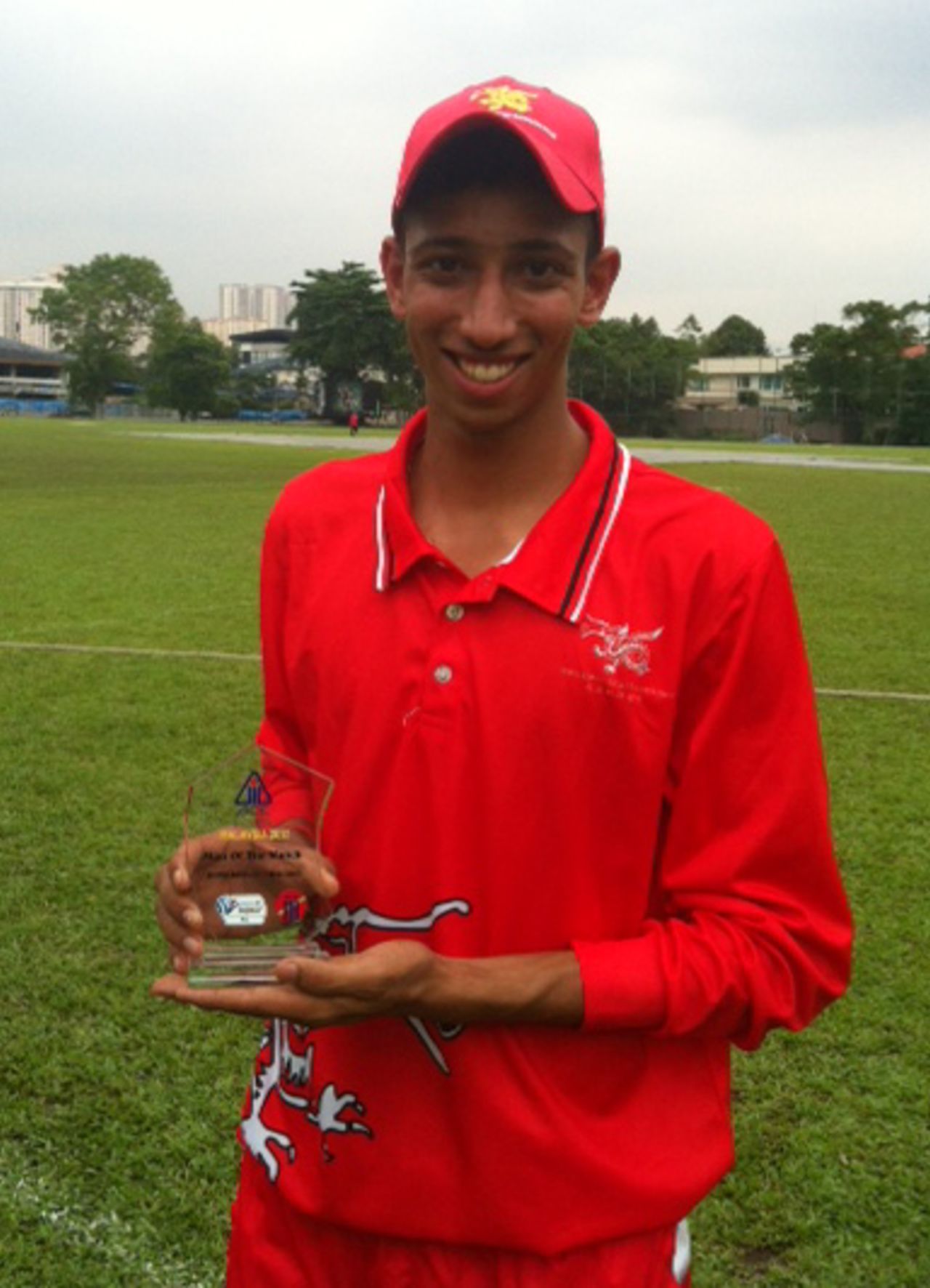 Mohammad Ghazanfar shows off his Man of the Match award for claiming 8-14 against Thailand U19 at the ACC Under-19 Elite 2013 in Malaysia