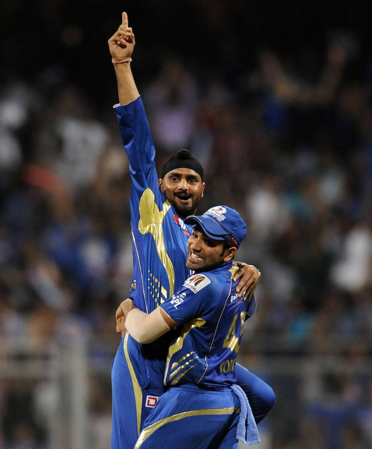 Harbhajan Singh and Rohit Sharma celebrate a wicket, Mumbai Indians v Kolkata Knight Riders, IPL, Mumbai, May 7, 2013