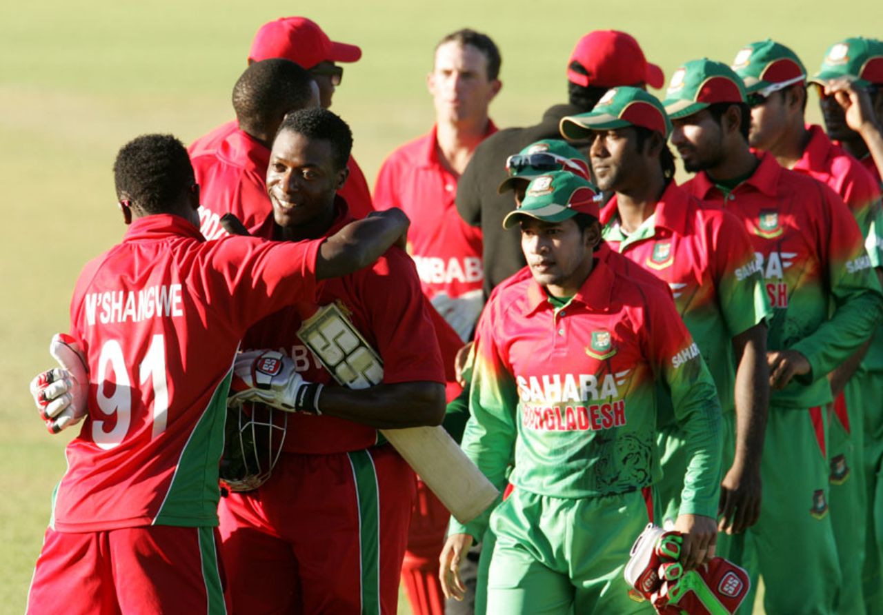 Vusi Sibanda's team-mates congratulate him as the teams walk off the field, Zimbabwe v Bangladesh, 3rd ODI, Bulawayo, May 8, 2013