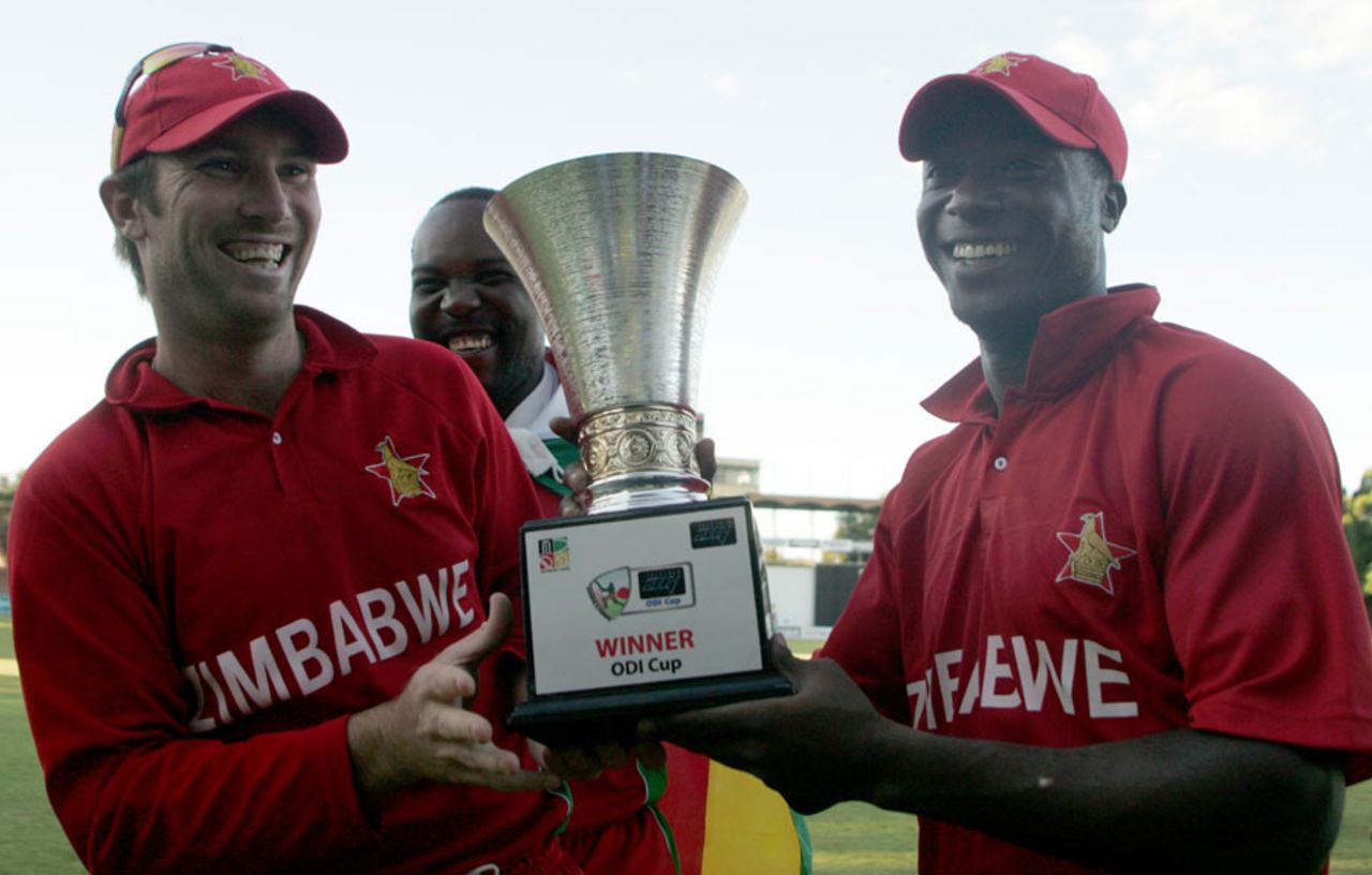 Brendan Taylor and Vusi Sibanda pose with the trophy, Zimbabwe v Bangladesh, 3rd ODI, Bulawayo, May 8, 2013