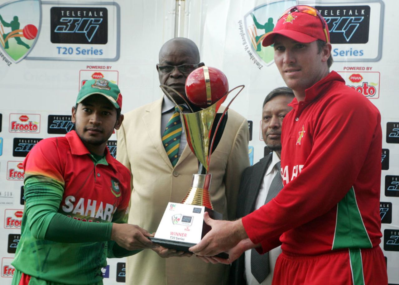 Mushfiqur Rahim and Brendan Taylor share the trophy after the series ended 1-1, Zimbabwe v Bangladesh, 2nd T20I, Bulawayo, May 12, 2013