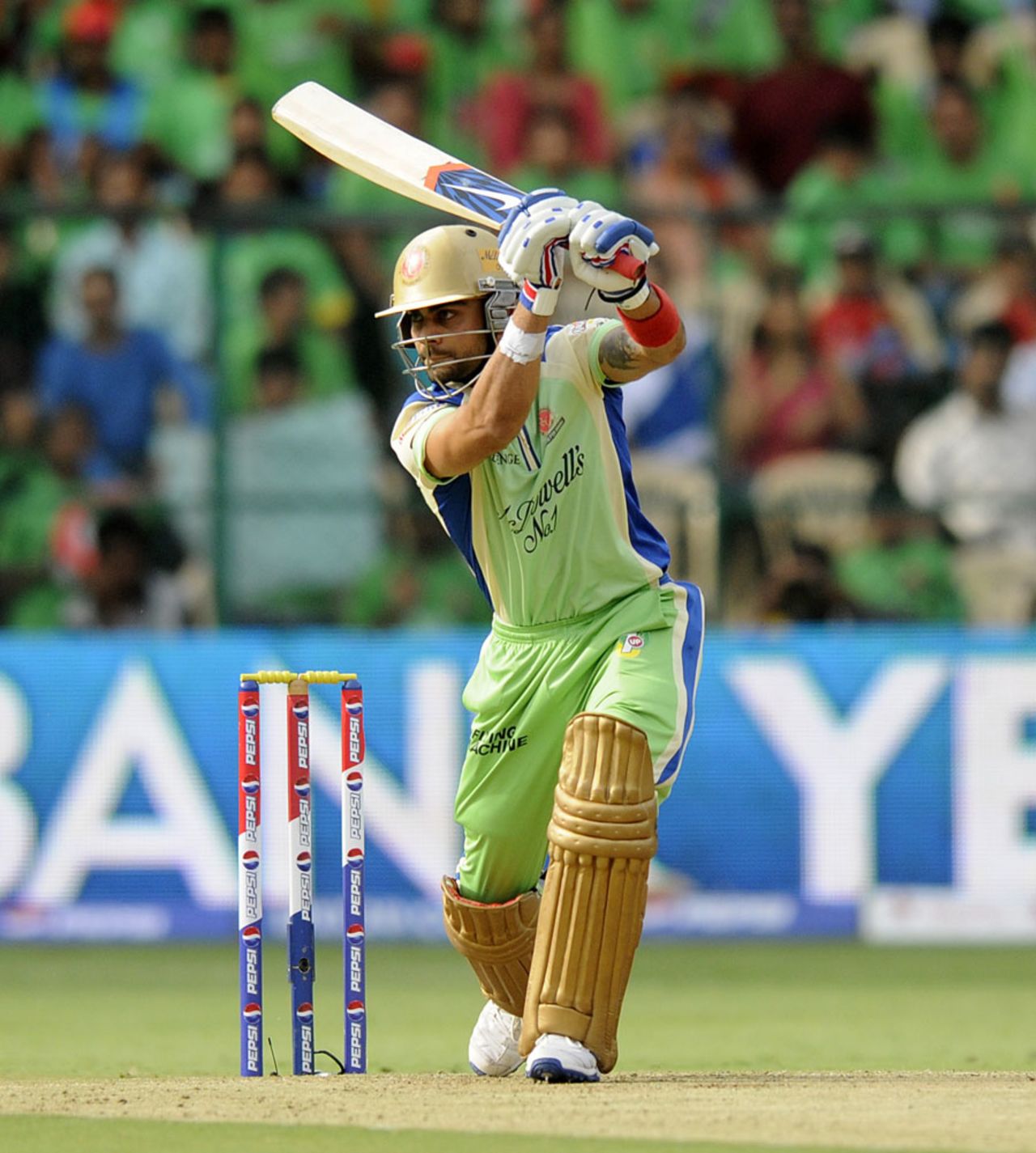 Virat Kohli punches a drive through the offside, Royal Challengers Bangalore v Kings XI Punjab, IPL 2013, Bangalore, May 14, 2013