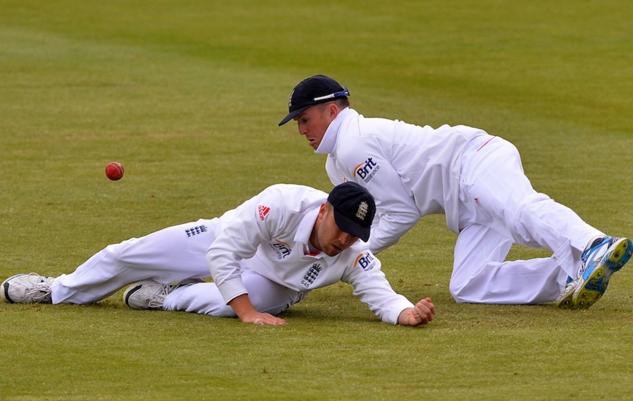 Jonathan Trott drops a catch after diving in front of Graeme Swann, England v New Zealand, 1st Investec Test, Lord's, 3rd day, May 18, 2013