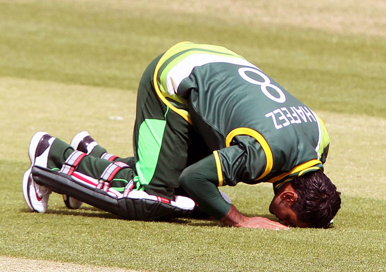 Mohammad Hafeez goes down to the turf after completing his century, Ireland v Pakistan, 1st ODI, Dublin, May 23, 2013