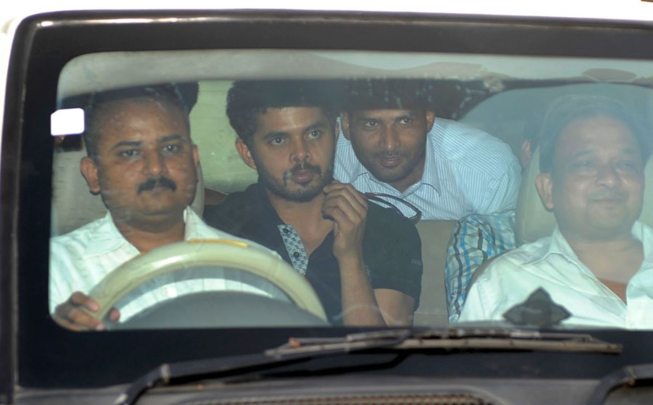 Sreesanth leaves Saket District Court with a police escort, New Delhi, May 26, 2013