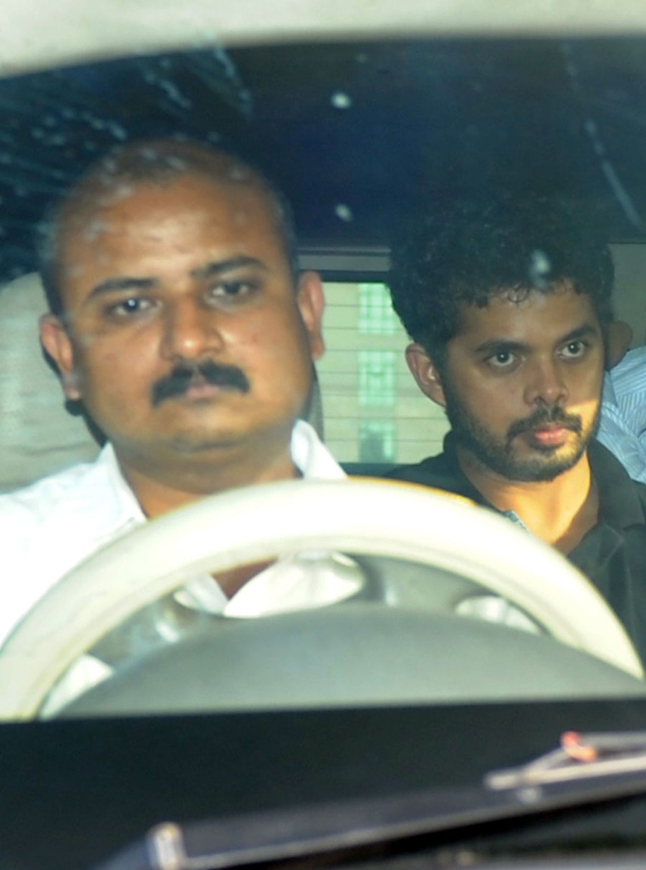 Sreesanth looks in the distance as he leaves Saket District Court, New Delhi, May 26, 2013