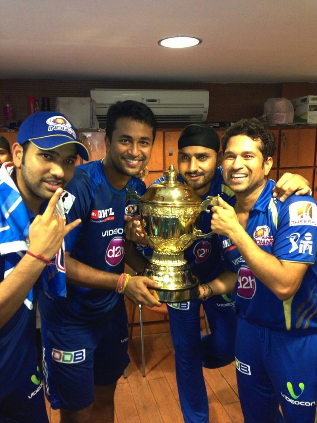 Rohit Sharma, Pragyan Ojha, Harbhajan Singh and Sachin Tendulkar with the trophy, Chennai Super Kings v Mumbai Indians, IPL final, Kolkata, May 26, 2013