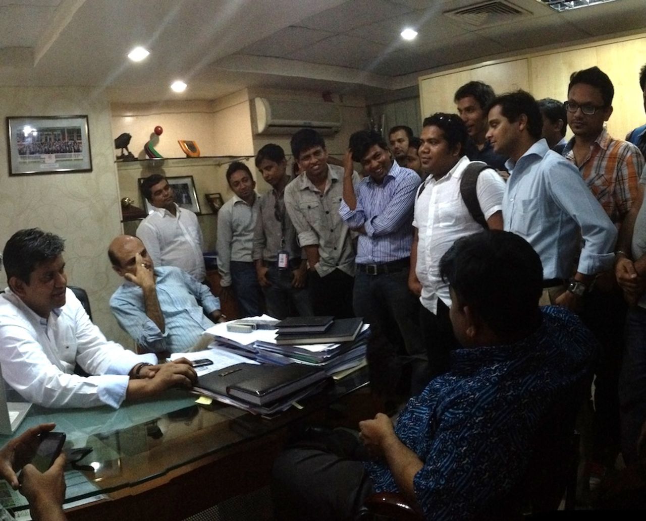 BCB interim committee member Jalal Yunus (right) explaining to the media that only the BCB president can make a statement regarding ACSU's investigation into alleged match and spot-fixing claims in the BPL. He is flanked by BCB's acting CEO  Nizamuddin Chowdhury whose office room was swarming with members of the Bangladesh media on Monday, June 3, 2013.