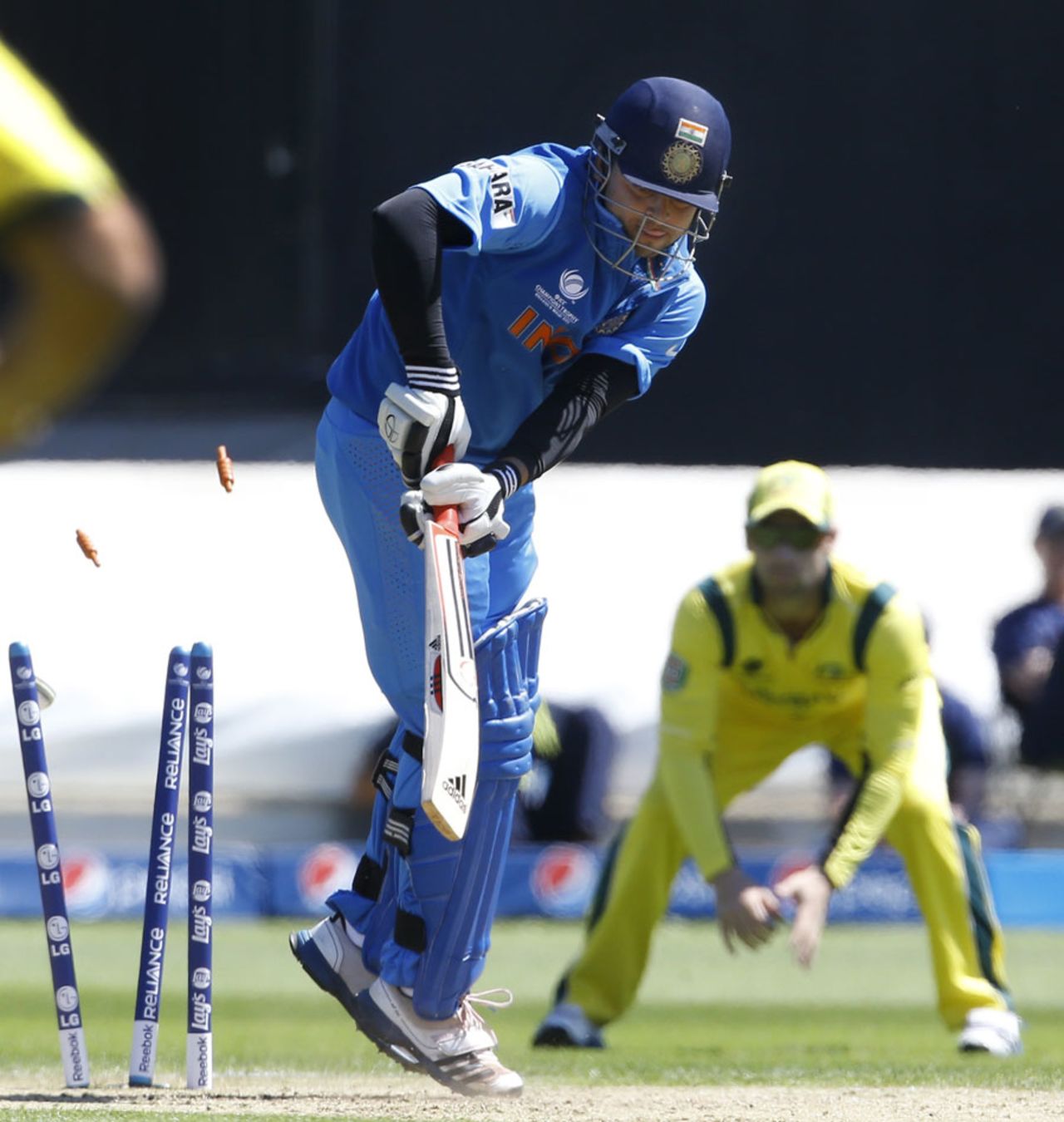 Suresh Raina is bowled by Clint McKay, Australia v India, Champions Trophy warm-up, Cardiff, June 4, 2013
