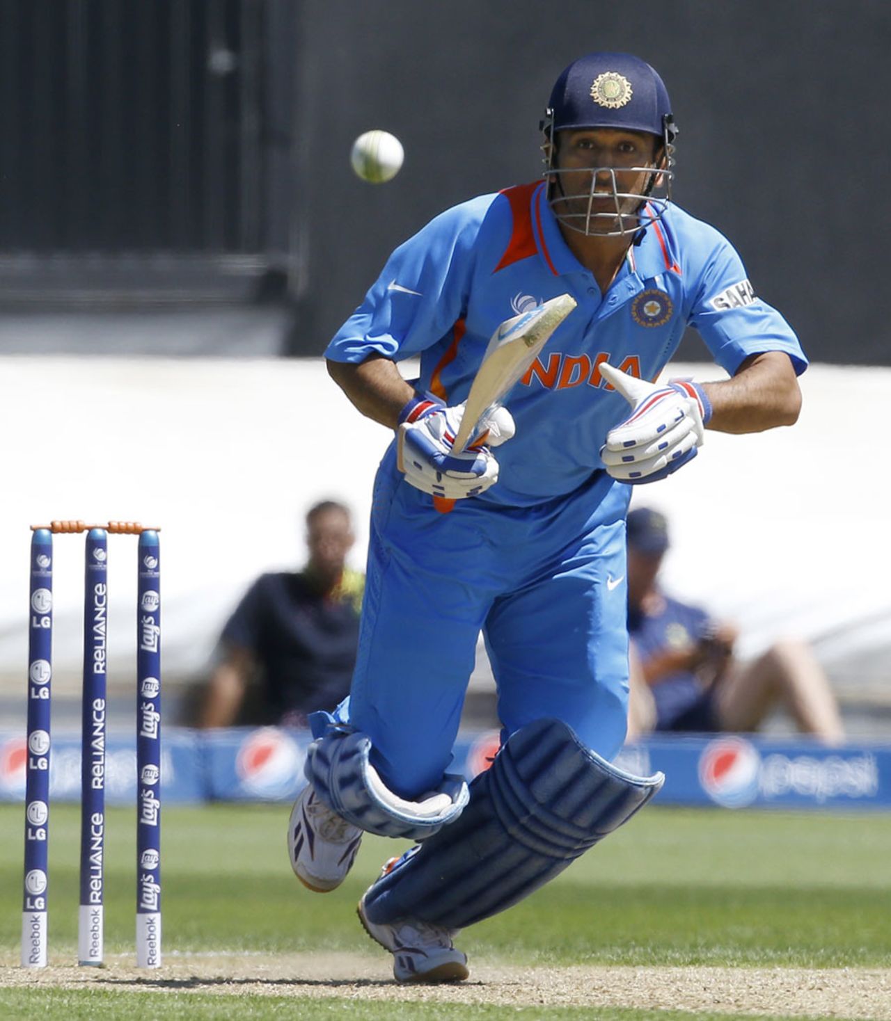 MS Dhoni sets off for a run after playing to the offside, Australia v India, Champions Trophy warm-up, Cardiff, June 4, 2013
