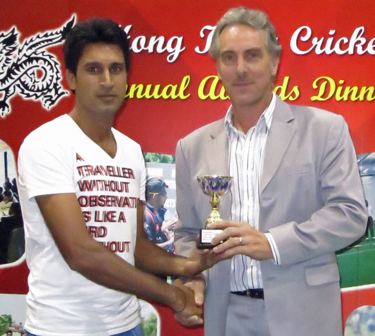 Tanwir Afzal received his Premier League Player of the Year trophy from HAB's Jonathan McKinley during the HKCA 2012-13 Awards Dinner held at Kowloon Cricket Club on 5th June 2013