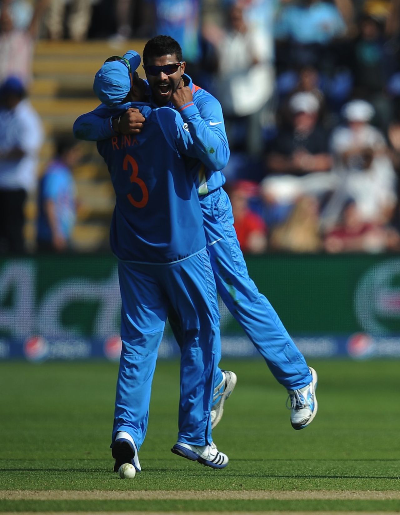 Ravindra Jadeja celebrates a wicket with Suresh Raina, India v South Africa, Champions Trophy, Group B, Cardiff, June 6, 2013