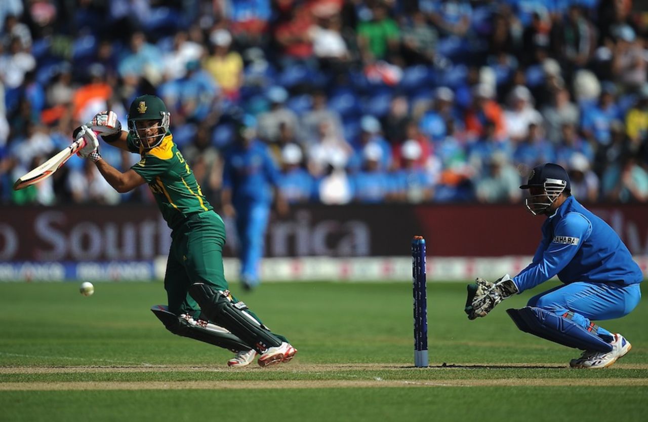 JP Duminy drives as MS Dhoni looks on, India v South Africa, Champions Trophy, Group B, Cardiff, June 6, 2013