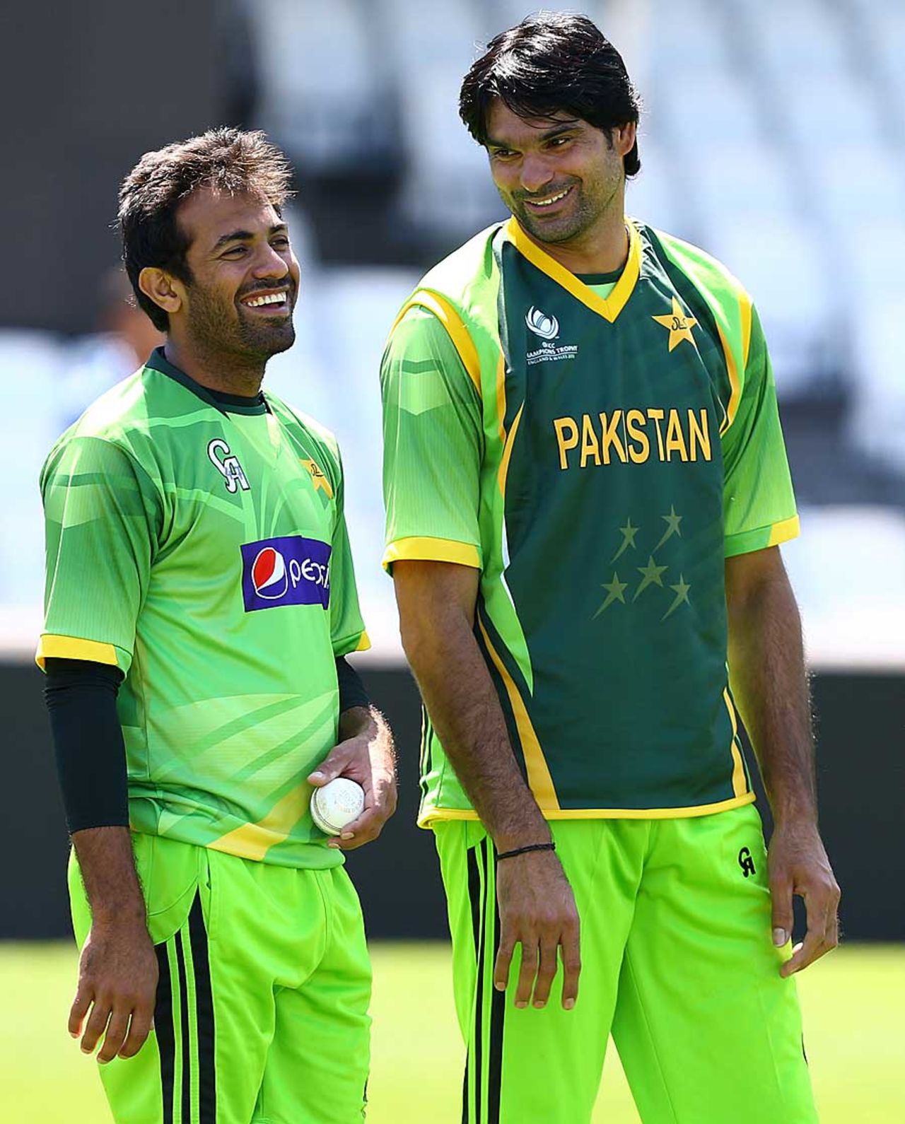 Wahab Riaz and Mohammad Irfan share a joke during practice, The Oval, June 5, 2013